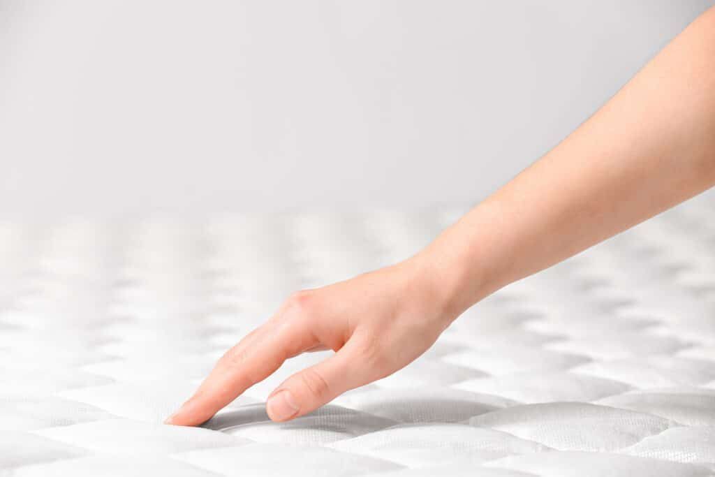 What is meant by the firmness of a mattress?